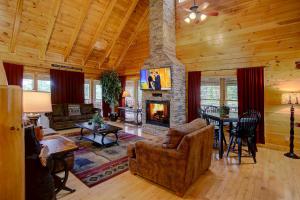 a living room with a couch and a fireplace at Belvedere by Eden Crest in Sevierville
