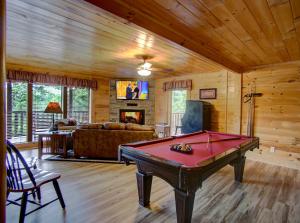 a living room with a pool table in it at Belvedere by Eden Crest in Sevierville