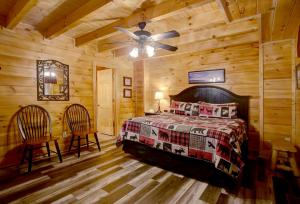 a bedroom with a bed and a ceiling fan at Belvedere by Eden Crest in Sevierville
