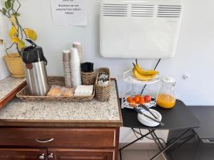 a kitchen counter with a basket of food and a blender at Relax Inn At Ashland in Ashland