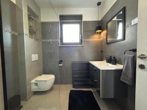 Łazienka w obiekcie Villa Korina , Pomer