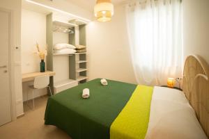 Voodi või voodid majutusasutuse Aura Apartments toas