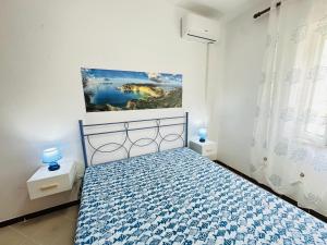 Postel nebo postele na pokoji v ubytování Tritone - Immobilevante