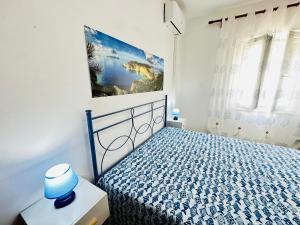 Postel nebo postele na pokoji v ubytování Tritone - Immobilevante