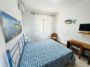 TV a/nebo společenská místnost v ubytování Tritone - Immobilevante