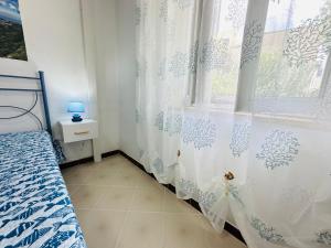 Postel nebo postele na pokoji v ubytování Tritone - Immobilevante