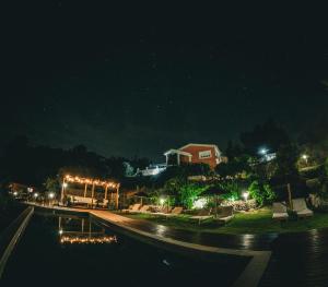 a street at night with a building and lights at Quinta Altamira in Portalegre