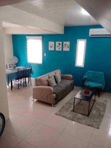 a living room with a couch and a table at Casa De Mira in Angeles
