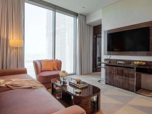 Télévision ou salle de divertissement dans l'établissement Hyde Hotel Dubai