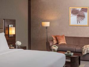 Un ou plusieurs lits dans un hébergement de l'établissement Hyde Hotel Dubai