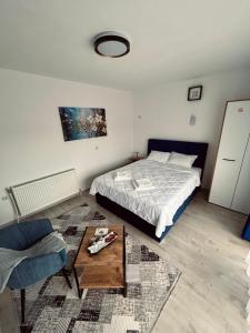 Postel nebo postele na pokoji v ubytování GreenHill Apartments