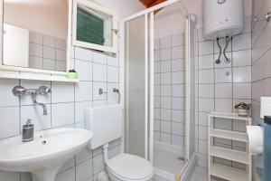 a bathroom with a toilet and a sink at Apartments by the sea Tisno, Murter - 815 in Tisno +40 photos
