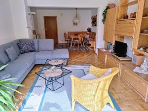 a living room with a couch and chairs and a table at Ferienwohnung Hinterstoißer in Berchtesgaden