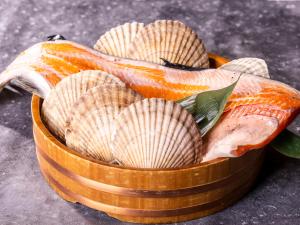 a bowl filled with shells and a fish at Hotel Gracery Sapporo in Sapporo