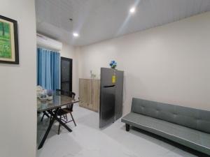 a living room with a couch and a table at Quirino hub (404) in Davao City