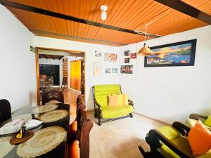 a living room with a table and chairs at Casa Hotel Camino Real in Guadalupe