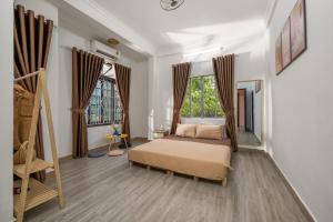 KLy Apartment Hotel客房内的一张或多张床位