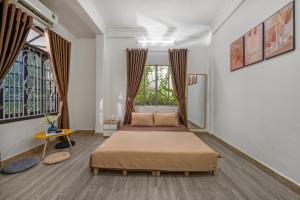 KLy Apartment Hotel客房内的一张或多张床位