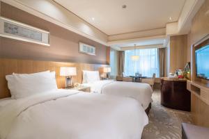 Voodi või voodid majutusasutuse C&D Hotel Quanzhou toas