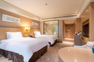 Voodi või voodid majutusasutuse C&D Hotel Quanzhou toas