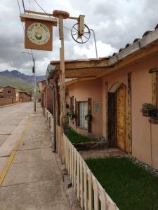 a building with a basketball hoop on top of it at Fully furnished 1bedroom apt in the Peruvian Andes in Sangarará
