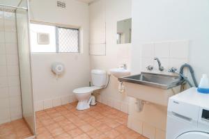 a bathroom with a sink and a toilet at Apartment 3 Burswood in Perth