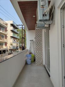 an empty balcony of a building with a window at 2BHK Luxury apartment in Dehradun in Dehradun