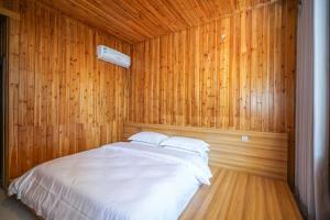 Postel nebo postele na pokoji v ubytování 楊家小院