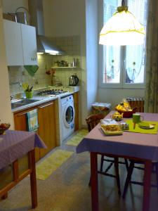 a kitchen with a table and a stove top oven at Da Anita in Rome