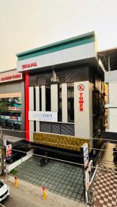 a store front of a building with a sign on it at Igloo Stays Kakkanad in Kakkanad