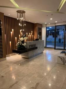 a lobby with a reception desk in a building at PARANAQUE STAYCATION at SPRING RESIDENCES T3 U1231 in Manila +97 photos