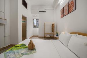 KLy Apartment Hotel客房内的一张或多张床位