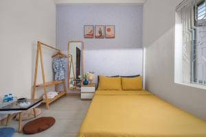 KLy Apartment Hotel客房内的一张或多张床位