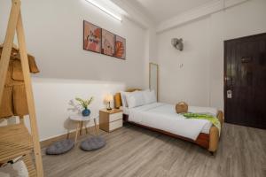KLy Apartment Hotel客房内的一张或多张床位