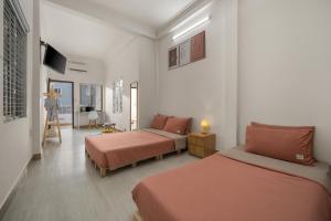 KLy Apartment Hotel客房内的一张或多张床位