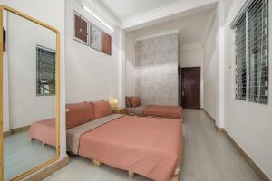KLy Apartment Hotel客房内的一张或多张床位