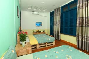 Postel nebo postele na pokoji v ubytování Sunny Hanoi Homestay