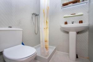 a bathroom with a toilet and a sink at Perseo in Torrevieja +28 photos