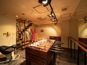 a room with a large chess set on a table at Towers Hotel - Adult Only - in Osaka