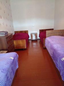 Rúm í herbergi á Iamze's Guest House