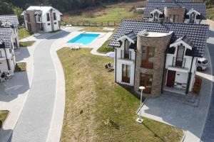 an aerial view of a house with a swimming pool at Royal King Villa 2 in Vrnjačka Banja