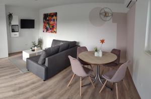 a living room with a couch and a table at Apartment Emili in Poljica