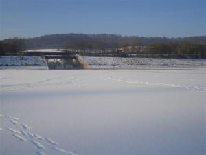 a frozen lake with snow on it with a skate ramp at Fewo Corell in Willingen
