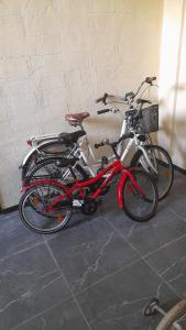 two bikes parked next to each other in a room at Apartment Vecliepaja in Liepāja