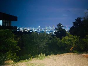 a view of the city at night at Sweet Lemon in Batumi