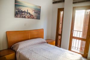 Postel nebo postele na pokoji v ubytování Apartamentos Turísticos Centro Histórico, by CartagenaSpain