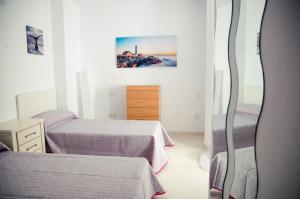 Postel nebo postele na pokoji v ubytování Apartamentos Turísticos Centro Histórico, by CartagenaSpain