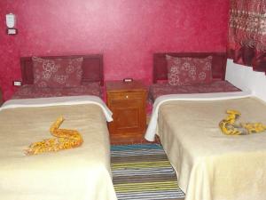 Postel nebo postele na pokoji v ubytování safari &hotel