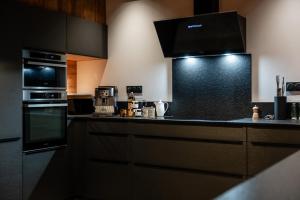 Kuchyň nebo kuchyňský kout v ubytování Chalet Le Refuge + 2 fotografie