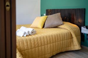 Postel nebo postele na pokoji v ubytování B&B La Timpa Del Cucco